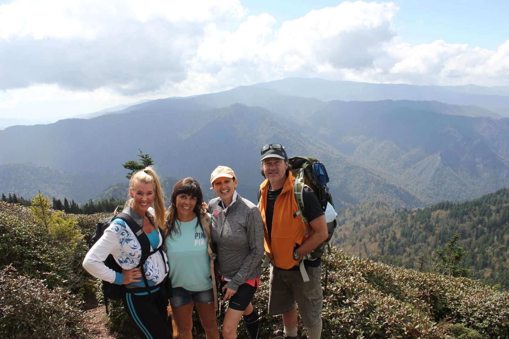 Group of people enjoying hiking at the mountain