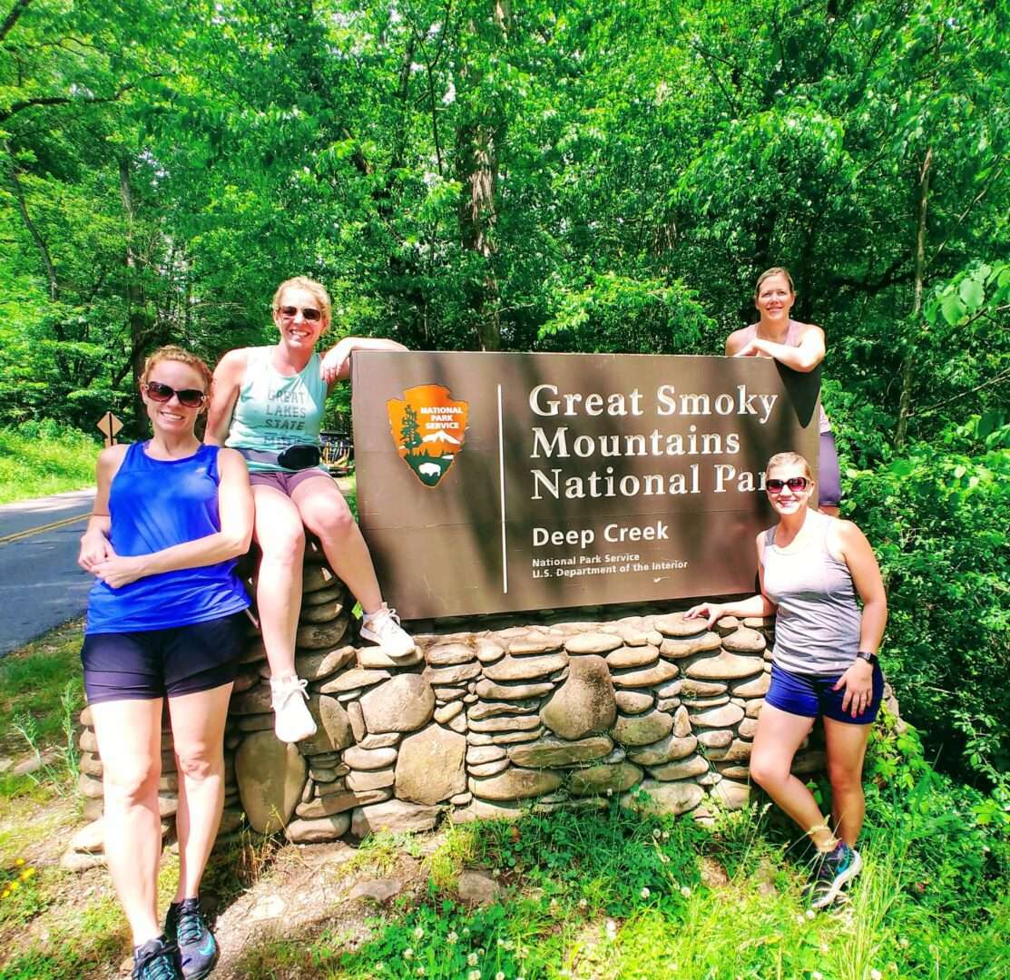 Group of people sitting near Great Smoky Mountains