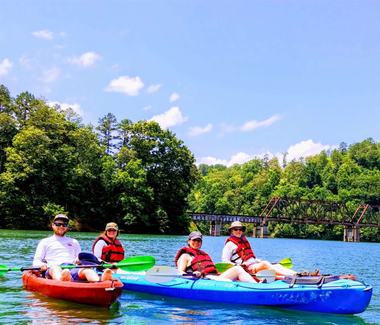 Two group of couple enjoying boat ride in lake