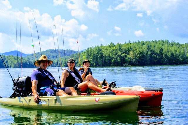 Guests catching fish on a guided kayak fishing tour