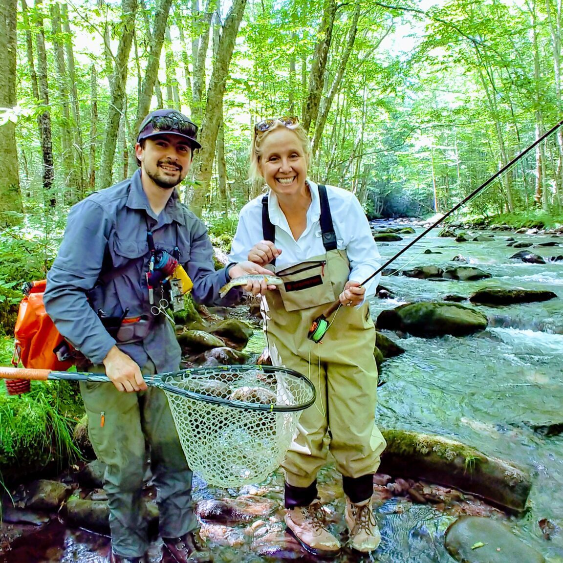 People doing fishing in a side of river