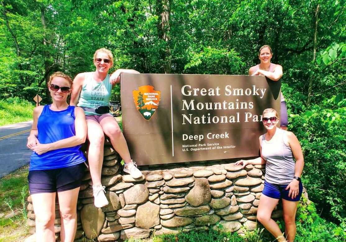 Group of people sitting near Great Smoky Mountains