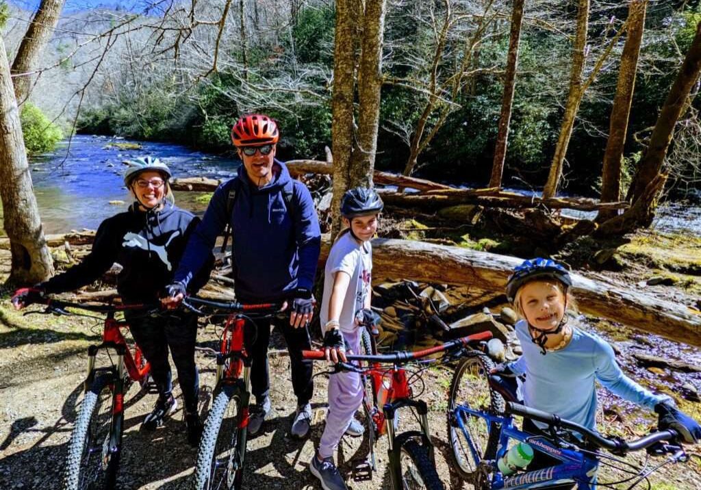 A group of people cycling at a mountain