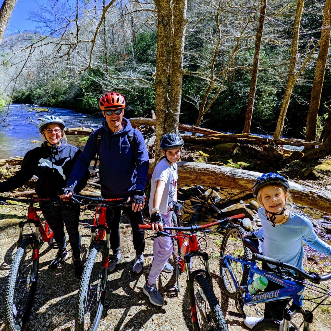 A group of people cycling at a mountain