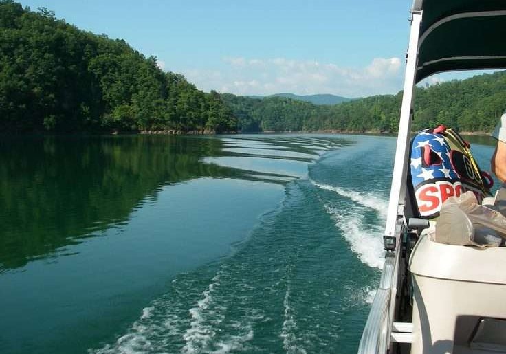 Moving Pontoon Boat With Peoples In A Water