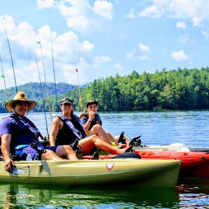 Guests catching fish on a guided kayak fishing tour
